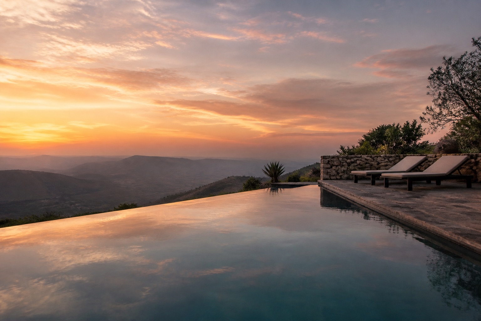 The infinity pool at the retreat resort, looking out over the valley at sunset